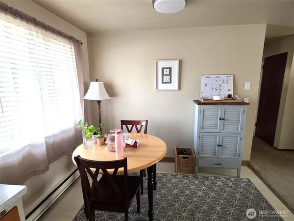a kitchen with a sink cabinets and window