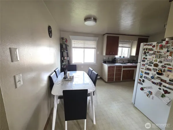 a kitchen with refrigerator and washer