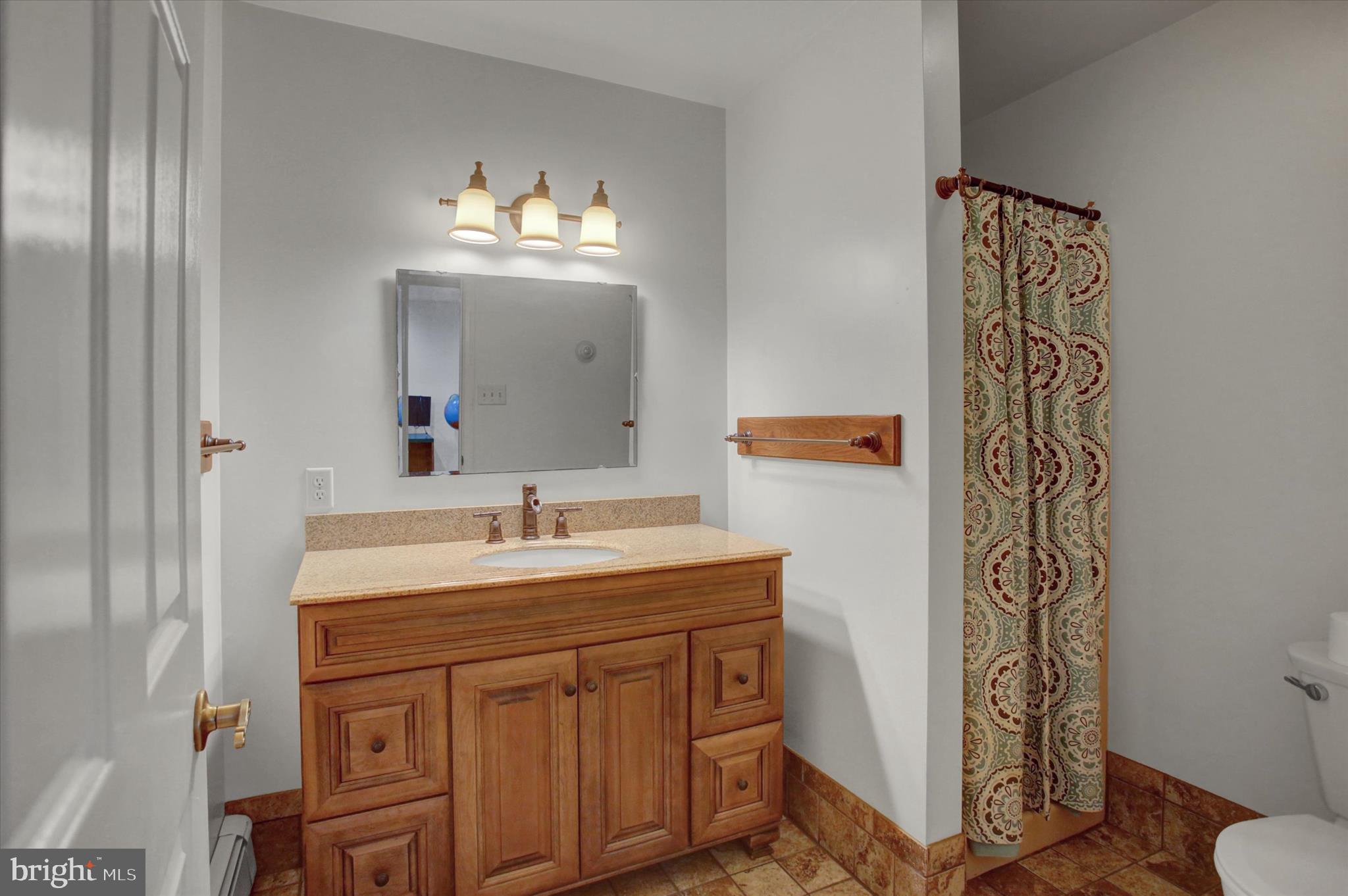 98 Peach Glen Road Gardners, PA 17324 - Photo 44 of 85 a bathroom with a sink and a mirror