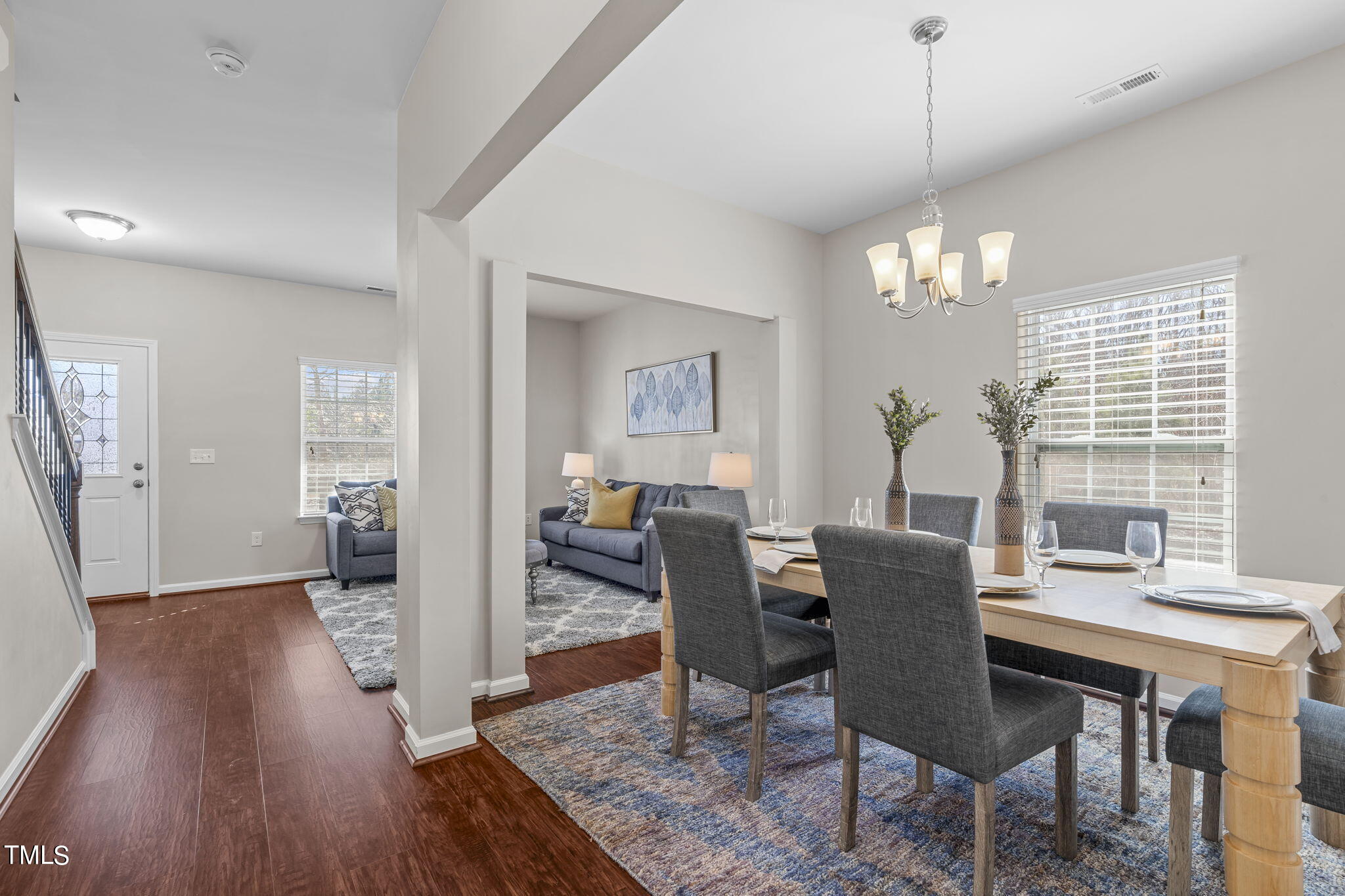 3652 Tule Spring Street Raleigh, NC 27610 - Photo 11 of 51 a view of a dining room with furniture window and wooden floor