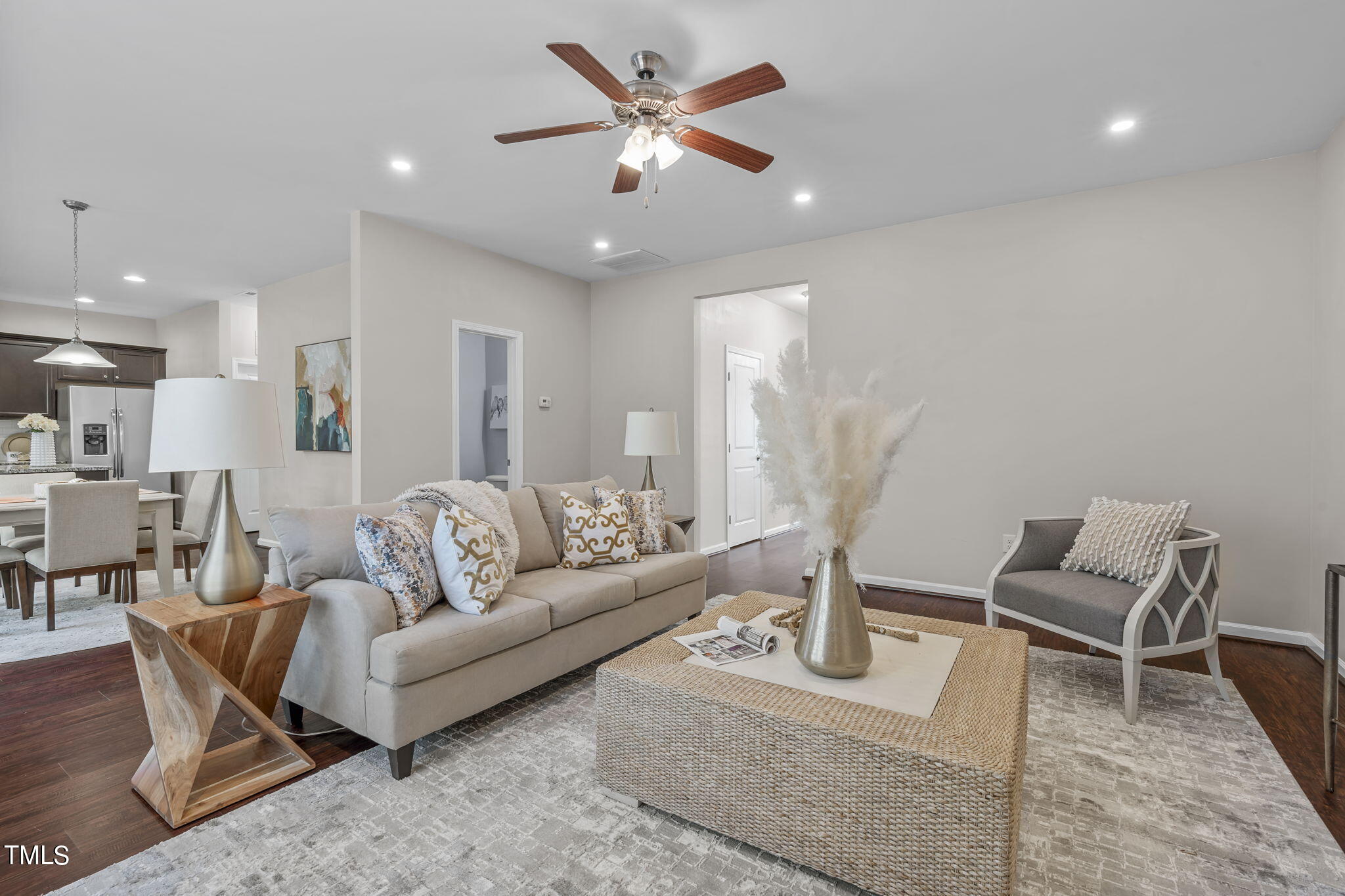 3652 Tule Spring Street Raleigh, NC 27610 - Photo 14 of 51 a living room with furniture and a chandelier