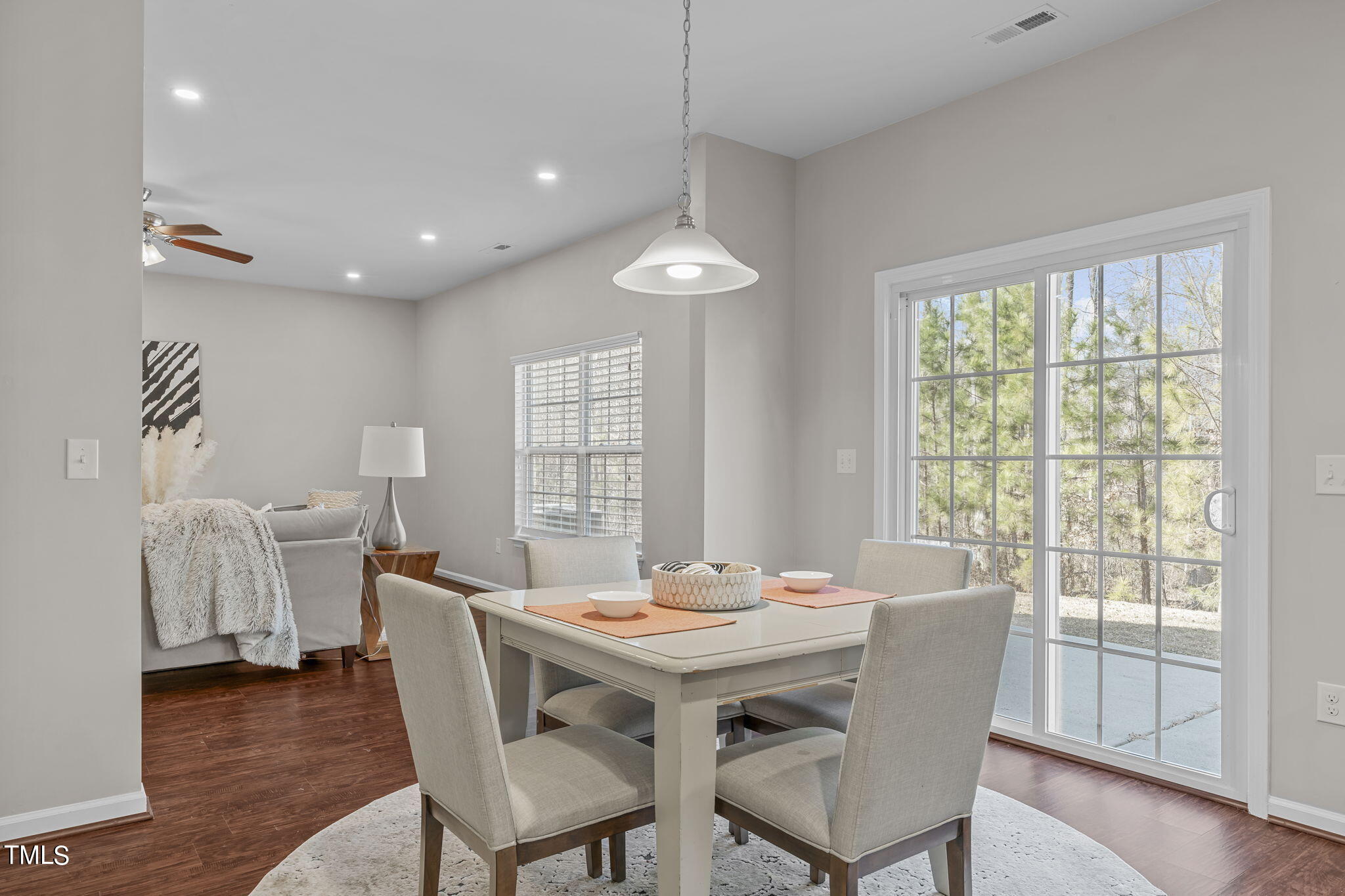 3652 Tule Spring Street Raleigh, NC 27610 - Photo 19 of 51 a view of a dining room with furniture window and wooden floor