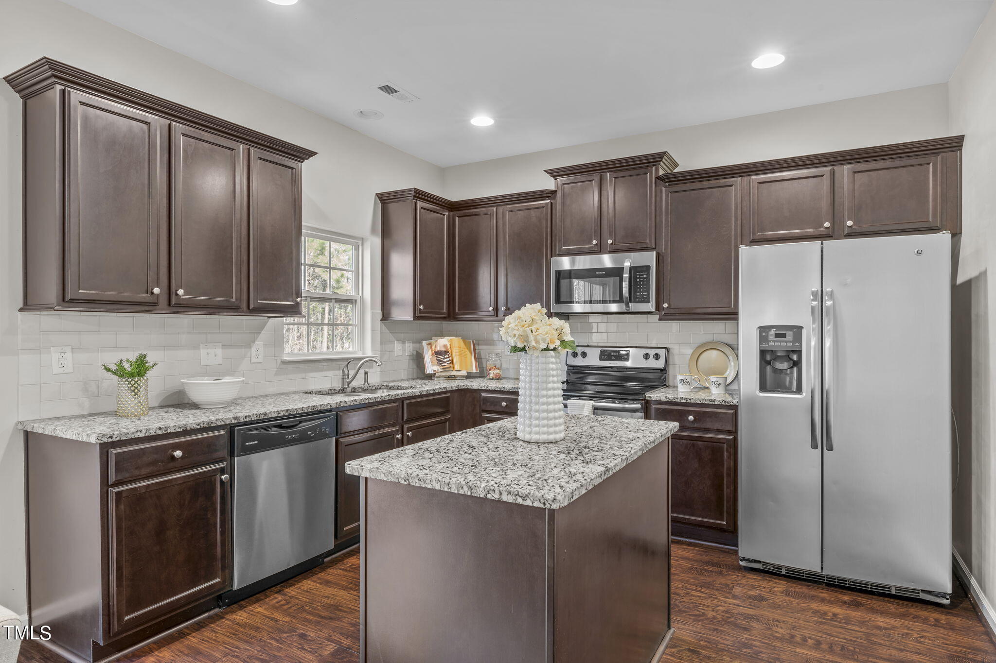 3652 Tule Spring Street Raleigh, NC 27610 - Photo 20 of 51 a kitchen with stainless steel appliances granite countertop a refrigerator stove a sink and dishwasher