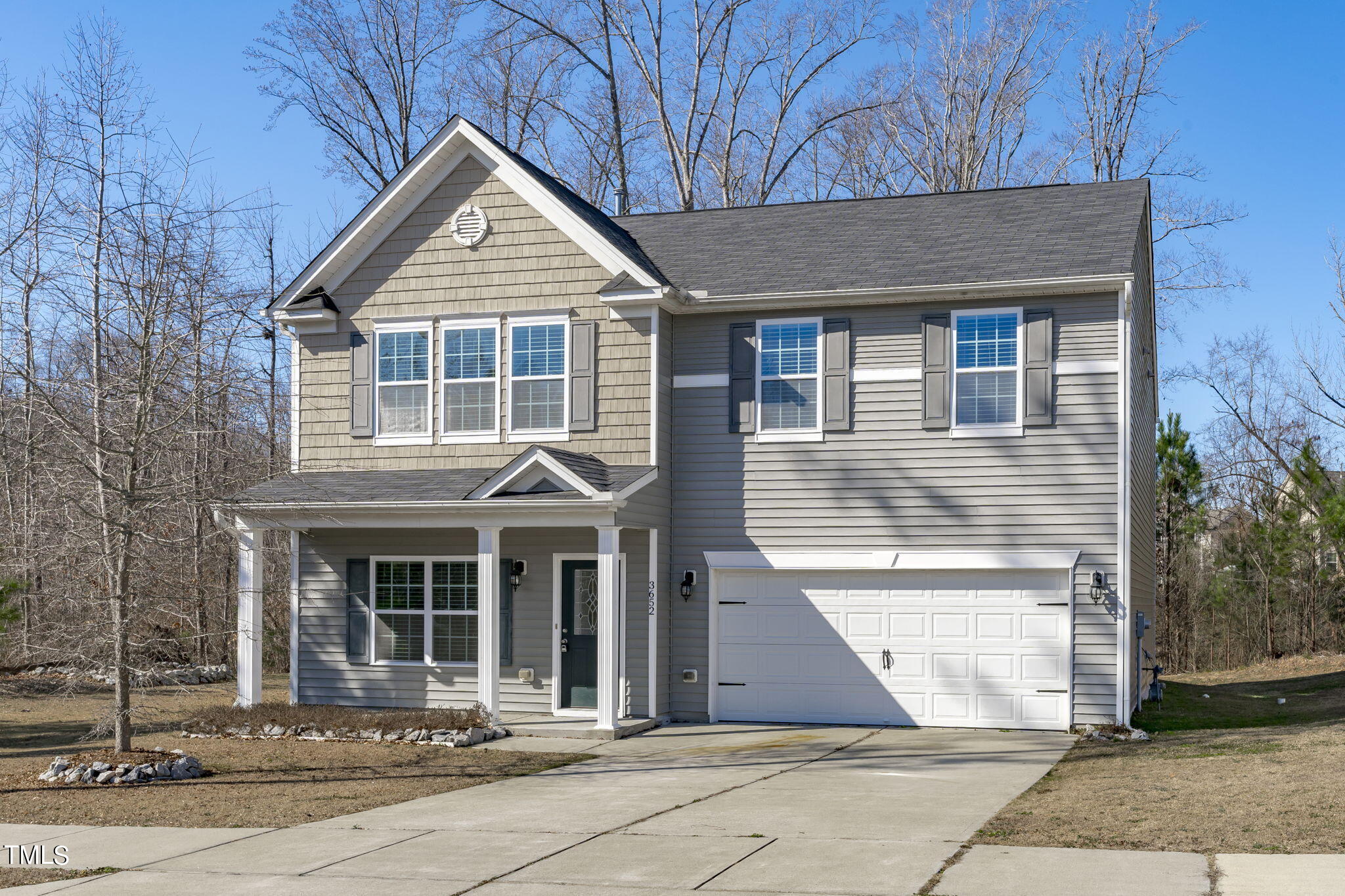 3652 Tule Spring Street Raleigh, NC 27610 - Photo 2 of 51 a front view of a house with a yard