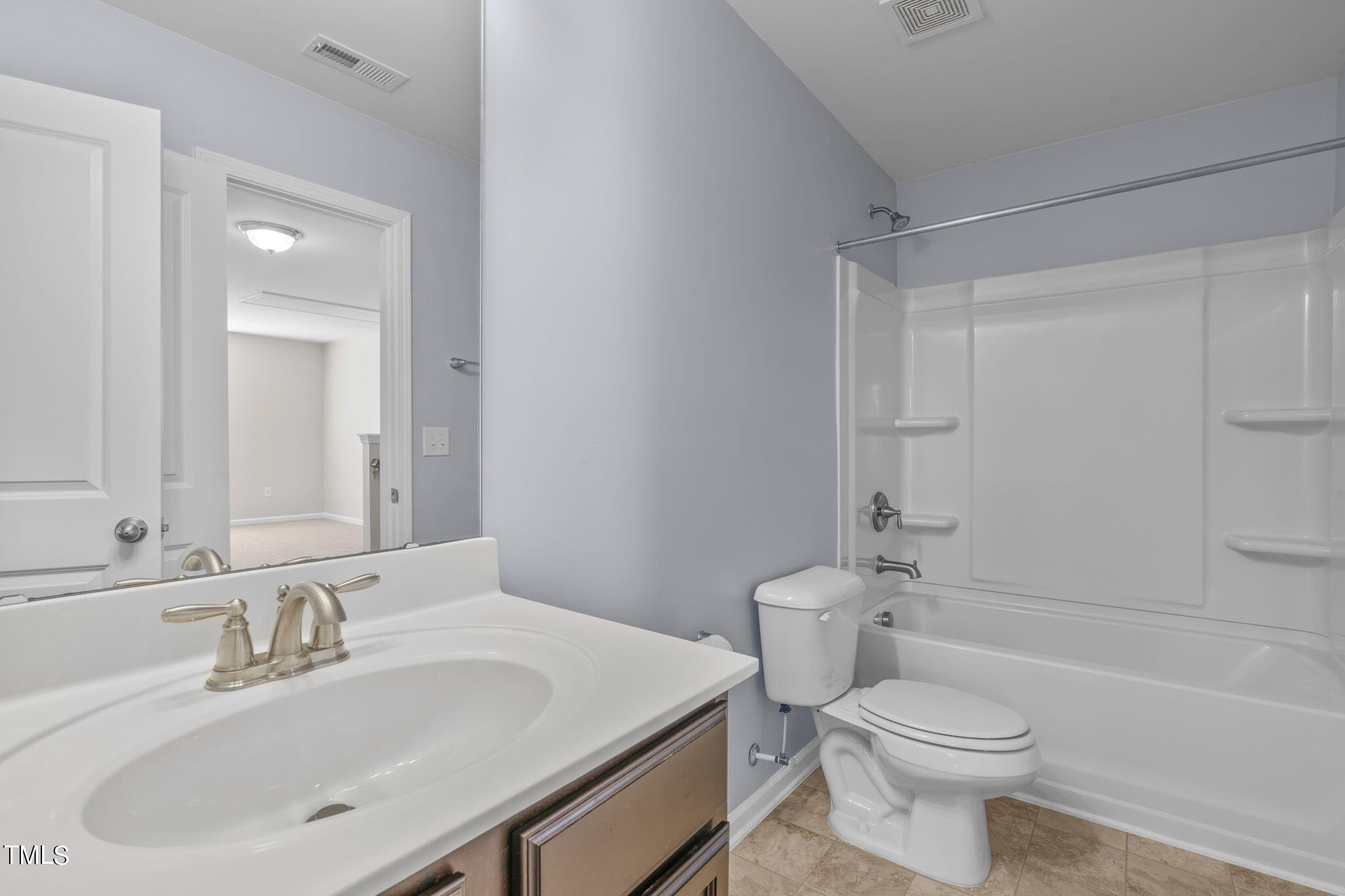 3652 Tule Spring Street Raleigh, NC 27610 - Photo 32 of 51 a bathroom with a sink toilet and shower