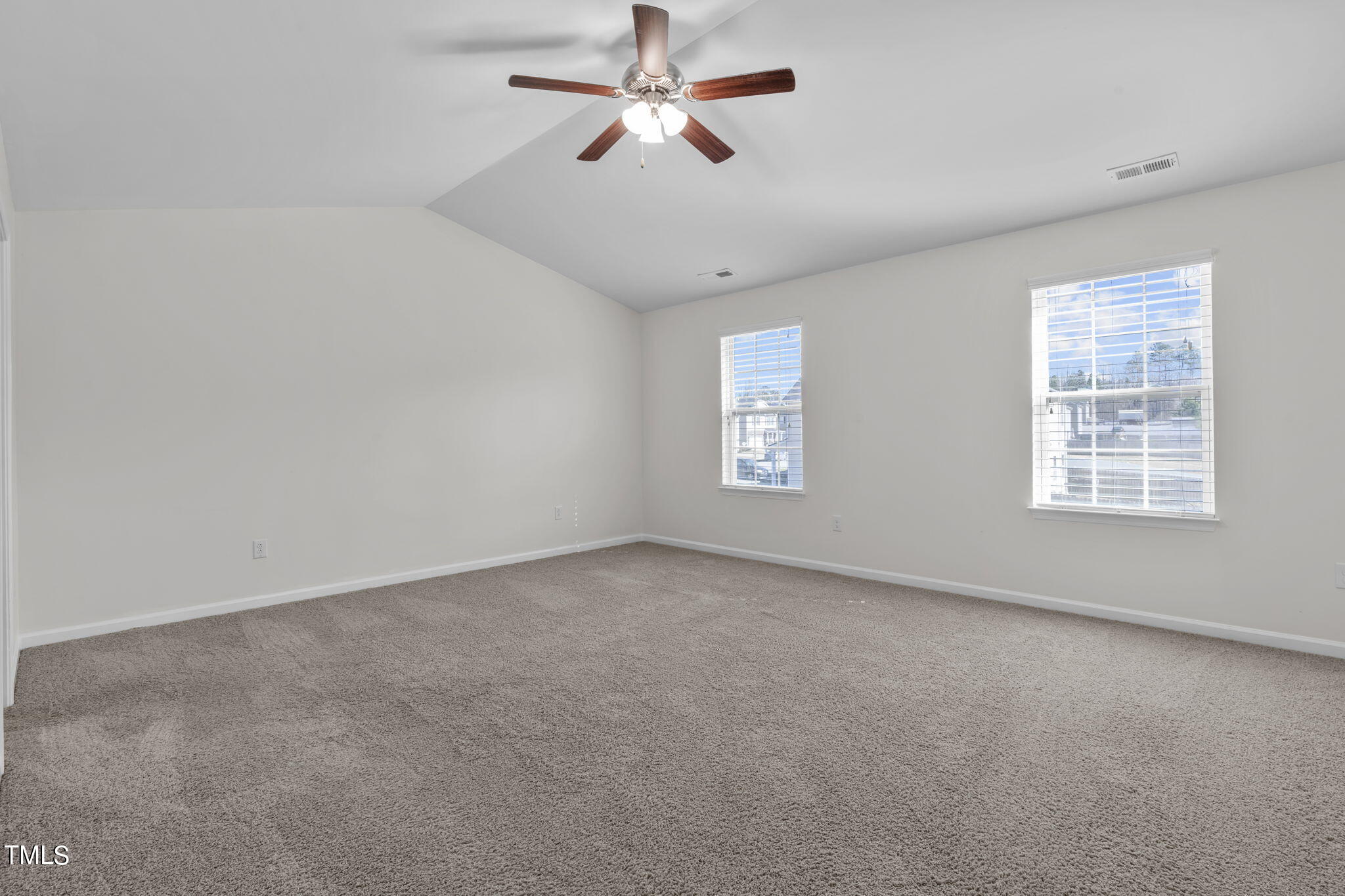 3652 Tule Spring Street Raleigh, NC 27610 - Photo 35 of 51 an empty room with windows and fan