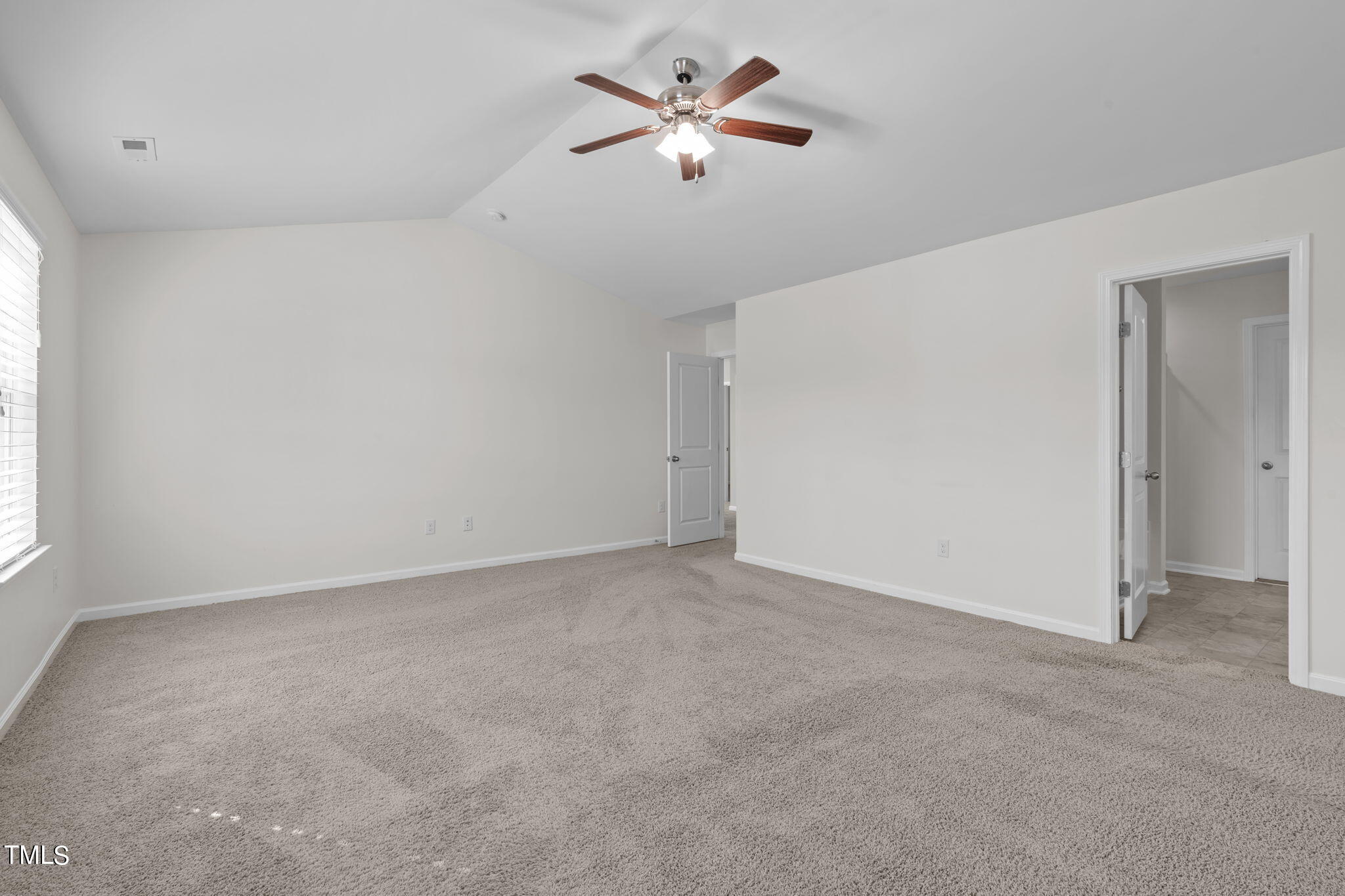 3652 Tule Spring Street Raleigh, NC 27610 - Photo 37 of 51 an empty room with fan and windows