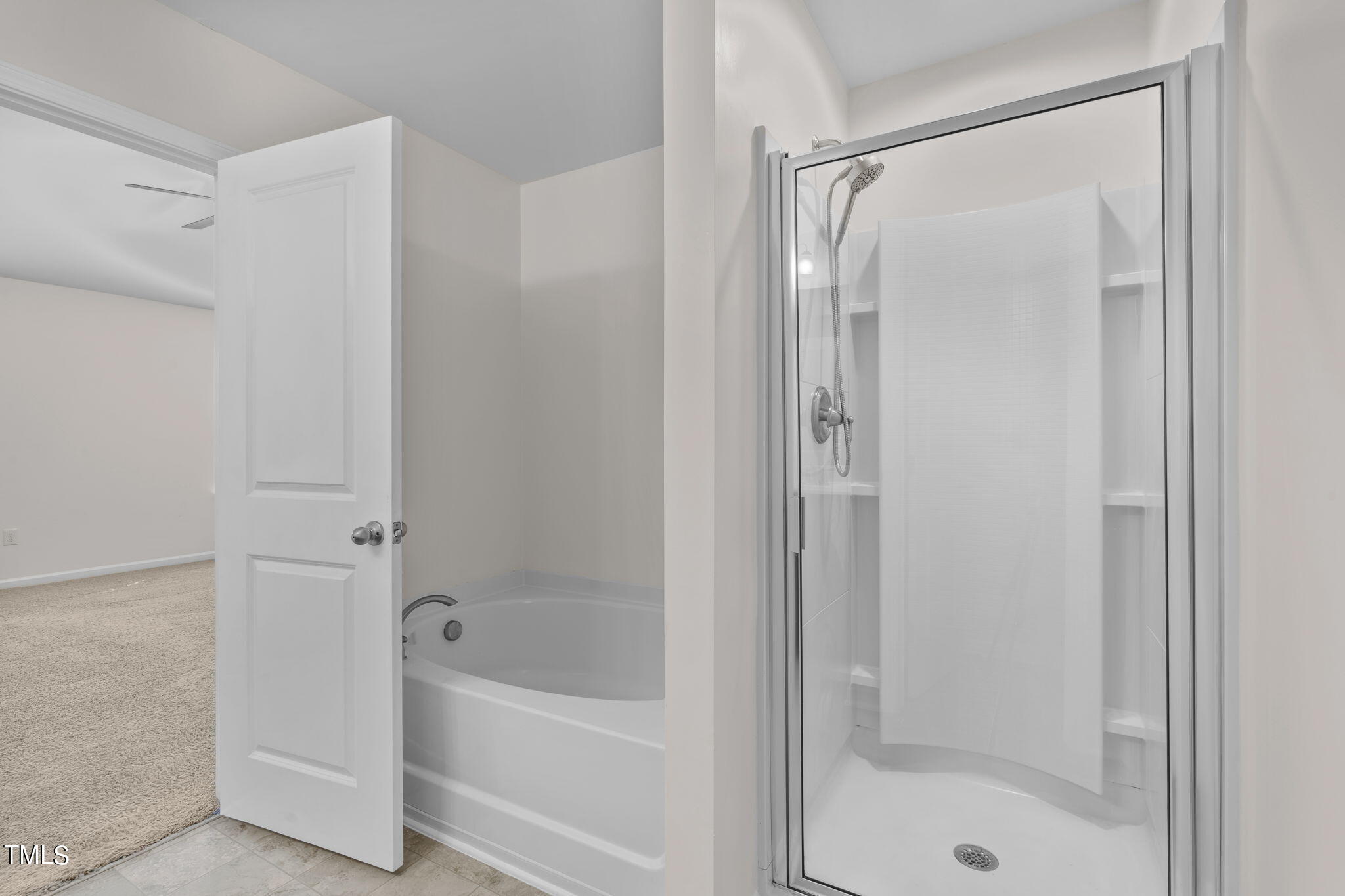 3652 Tule Spring Street Raleigh, NC 27610 - Photo 39 of 51 a bathroom with a bathtub and a shower