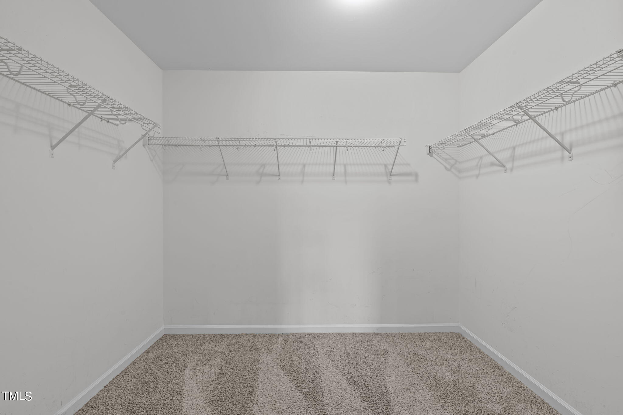 3652 Tule Spring Street Raleigh, NC 27610 - Photo 40 of 51 a view of a room with racks on the wall