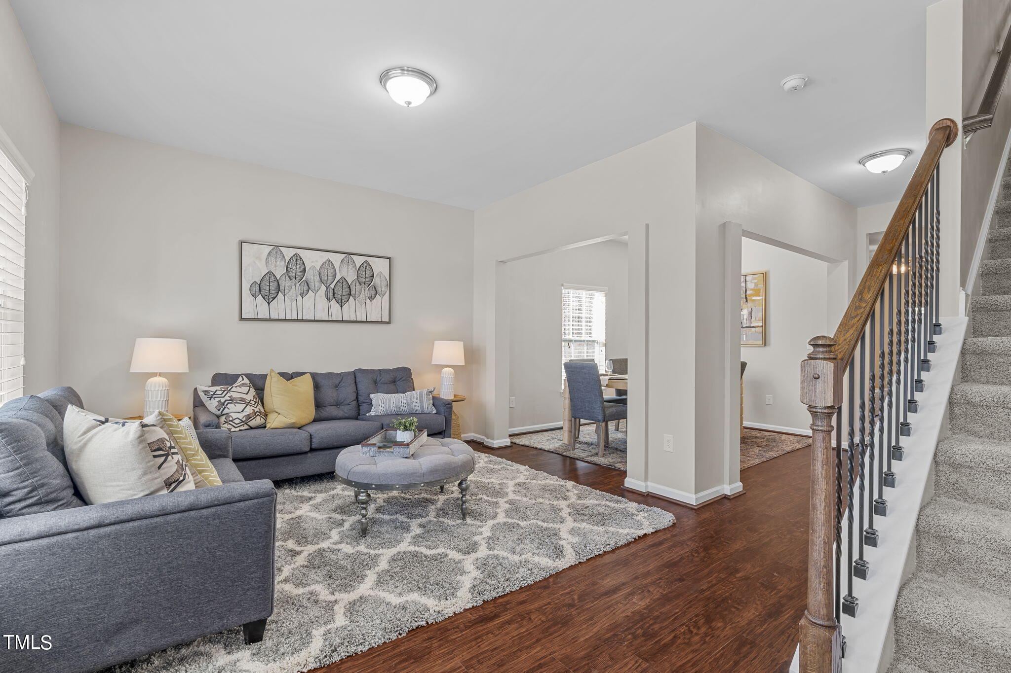 3652 Tule Spring Street Raleigh, NC 27610 - Photo 4 of 51 a living room with furniture and a wooden floor