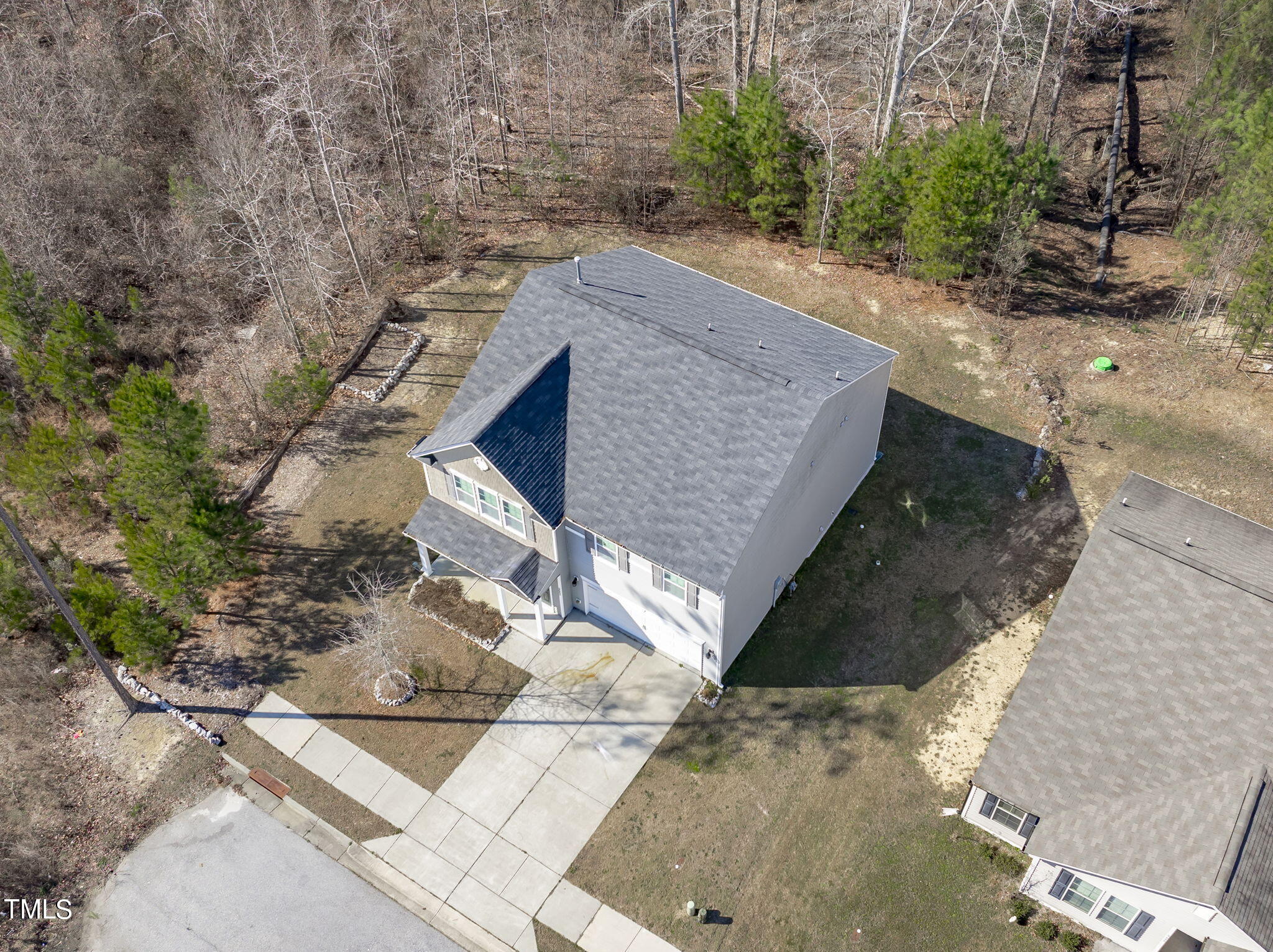 3652 Tule Spring Street Raleigh, NC 27610 - Photo 45 of 51 a view of a backyard with wooden fence