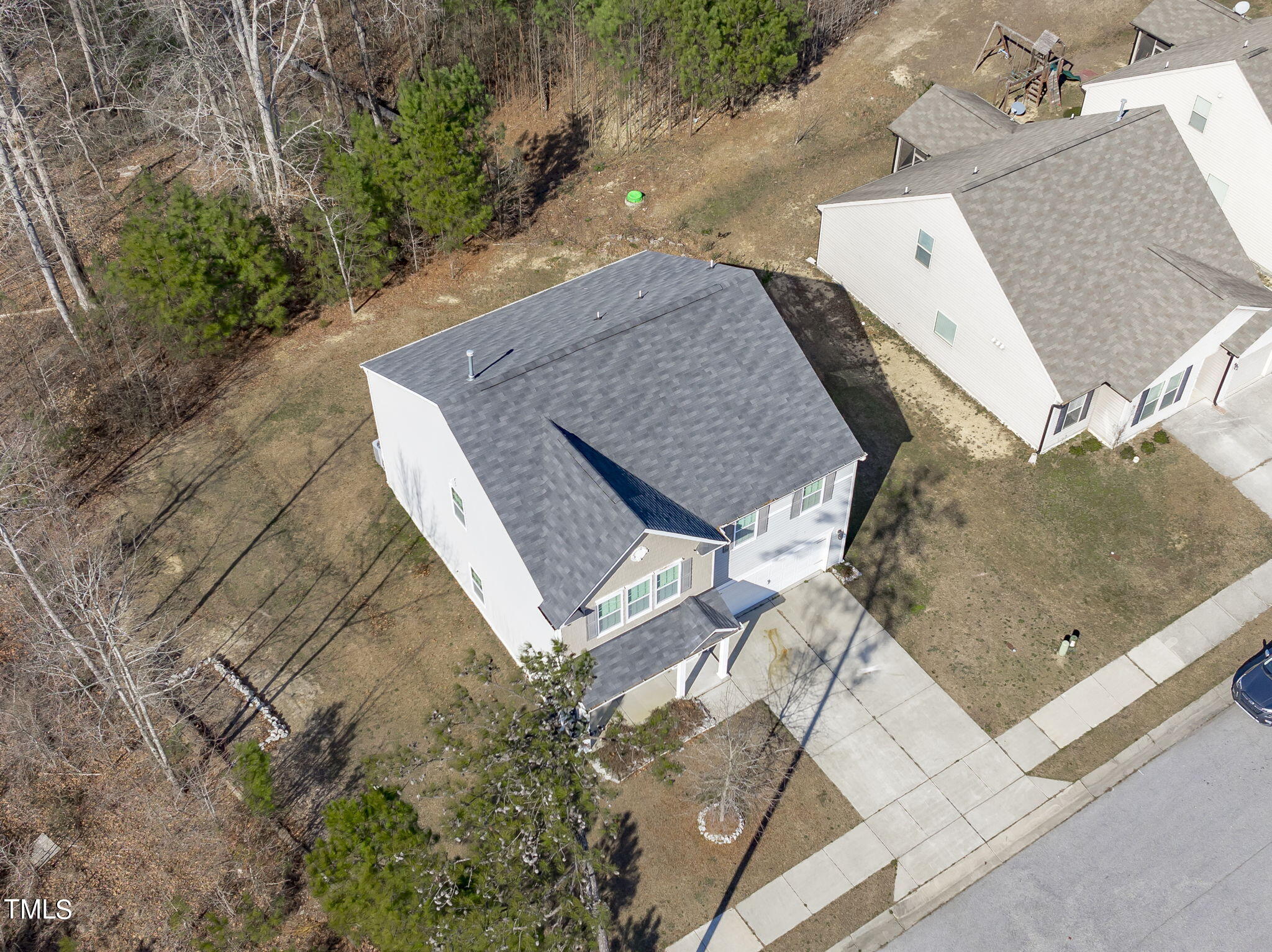 3652 Tule Spring Street Raleigh, NC 27610 - Photo 47 of 51 an aerial view of a house with a yard and wooden fence