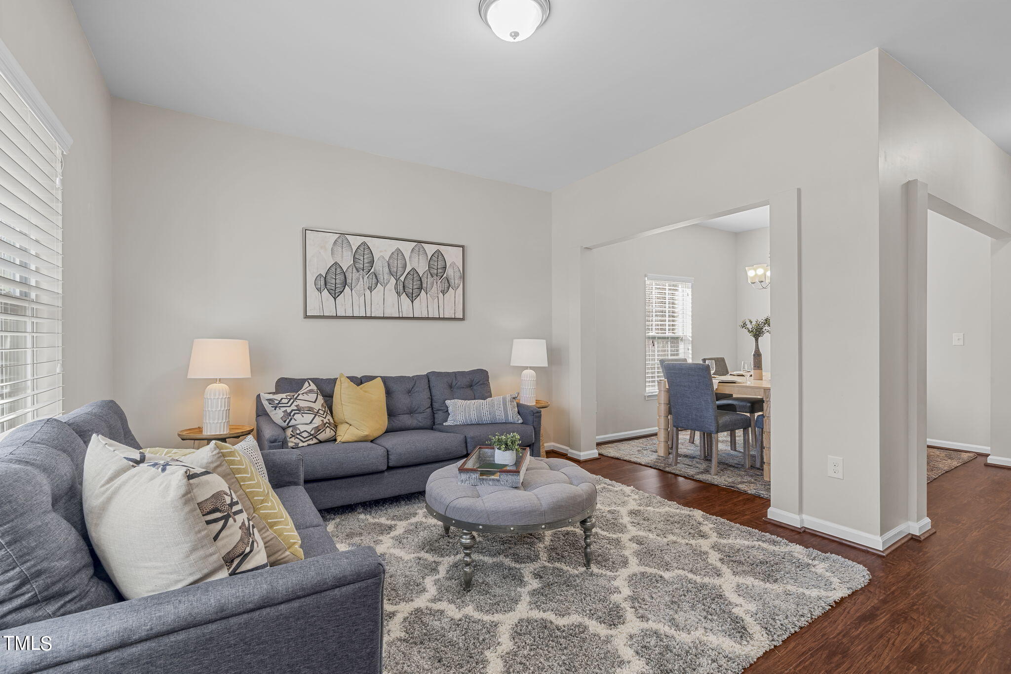 3652 Tule Spring Street Raleigh, NC 27610 - Photo 5 of 51 a living room with furniture and a wooden floor