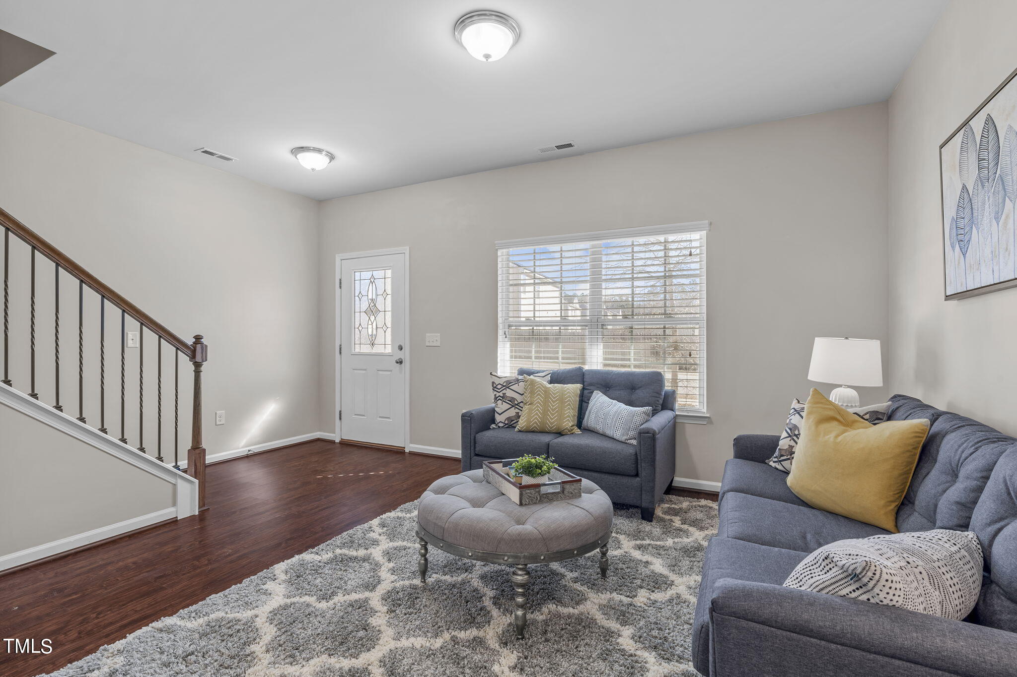 3652 Tule Spring Street Raleigh, NC 27610 - Photo 7 of 51 a living room with furniture and a large window