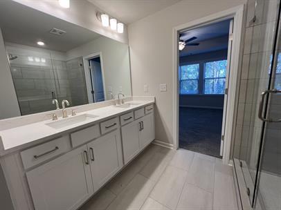 2267 Graywell Lane Duluth, GA 30096 - Photo 15 of 26 a bathroom with a double vanity sink and a mirror