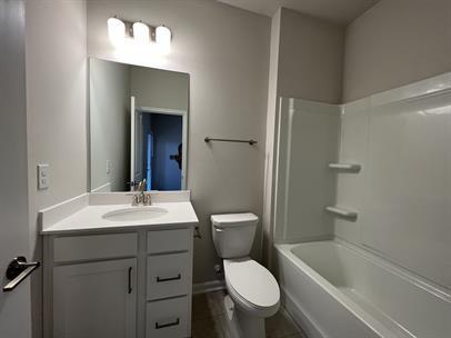 2267 Graywell Lane Duluth, GA 30096 - Photo 21 of 26 a bathroom with a sink toilet vanity and tub