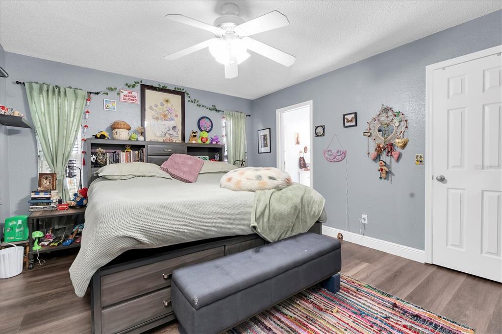 12107 72nd Way Largo, FL 33773 - Photo 19 of 40 a bedroom with a bed couch and a window