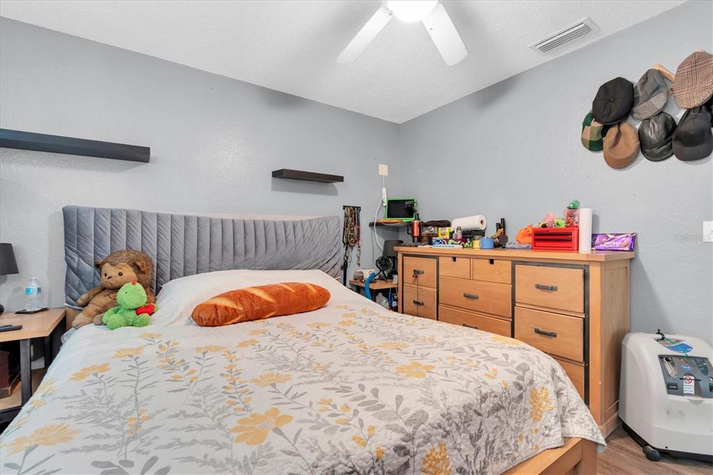 12107 72nd Way Largo, FL 33773 - Photo 25 of 40 a bedroom with a bed and a baby crib