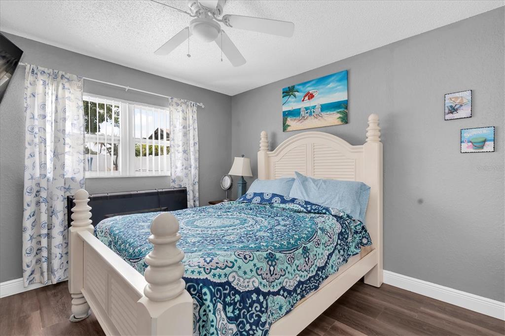 12107 72nd Way Largo, FL 33773 - Photo 26 of 40 a bedroom with a large bed and a window