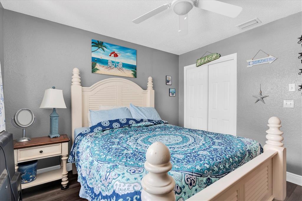 12107 72nd Way Largo, FL 33773 - Photo 27 of 40 a bedroom with a bed and a dresser