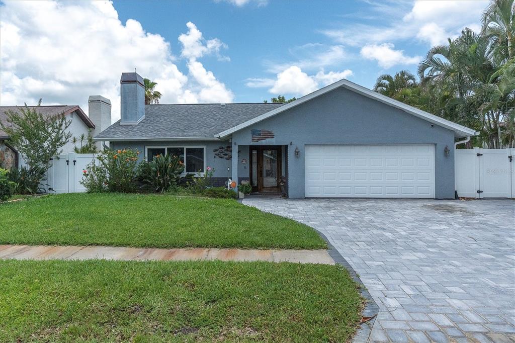 12107 72nd Way Largo, FL 33773 - Photo 40 of 40 a view of a house with a yard plants and a large tree