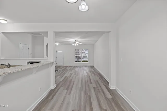 a view of a bathroom with double vanity and a mirror