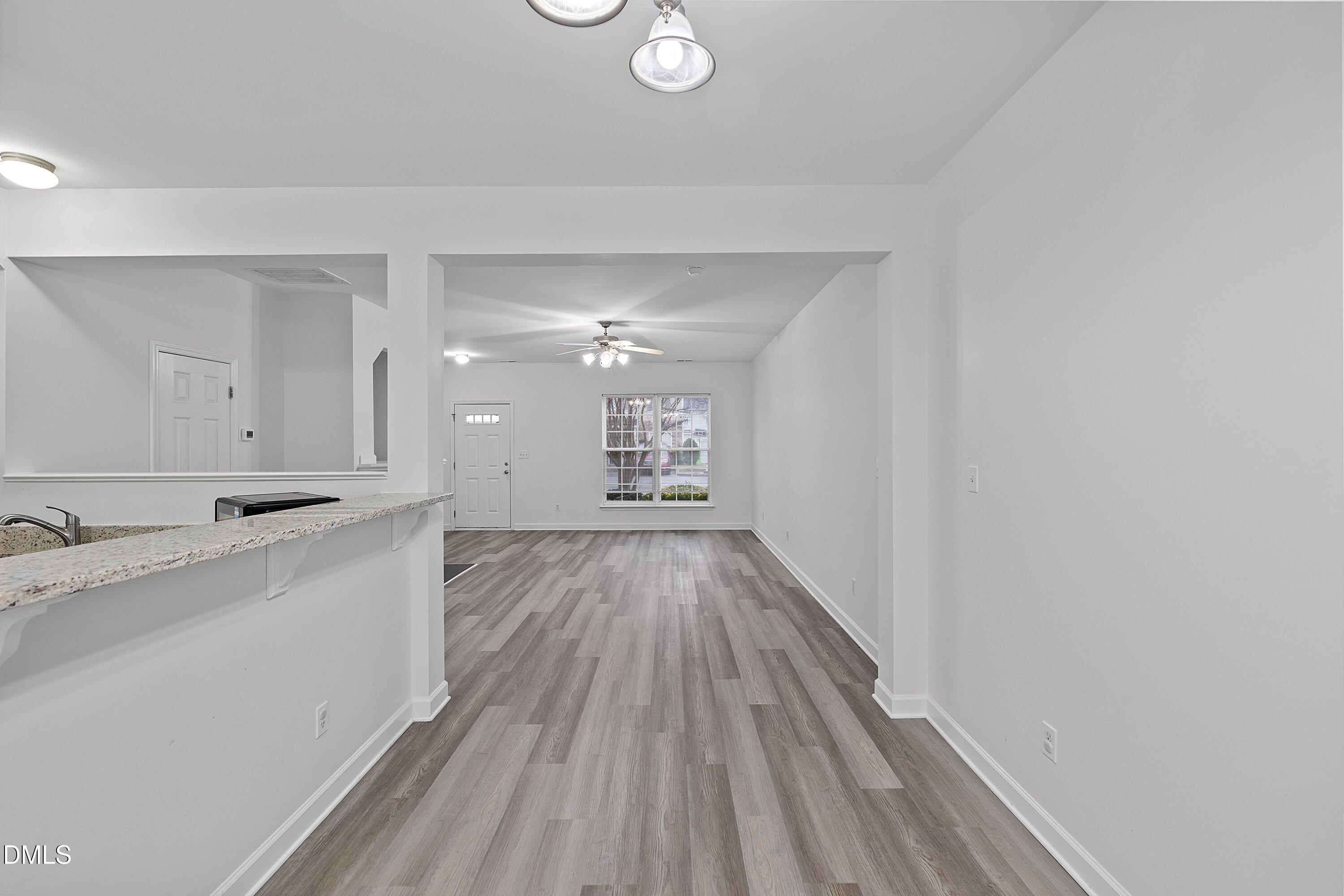 8321 Glenwood Springs Court Raleigh, NC 27616 - Photo 15 of 37 a view of a bathroom with double vanity and a mirror