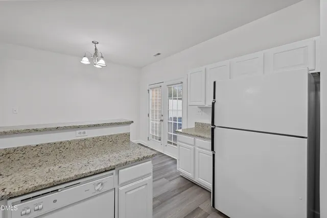 a kitchen with a refrigerator a sink and dishwasher