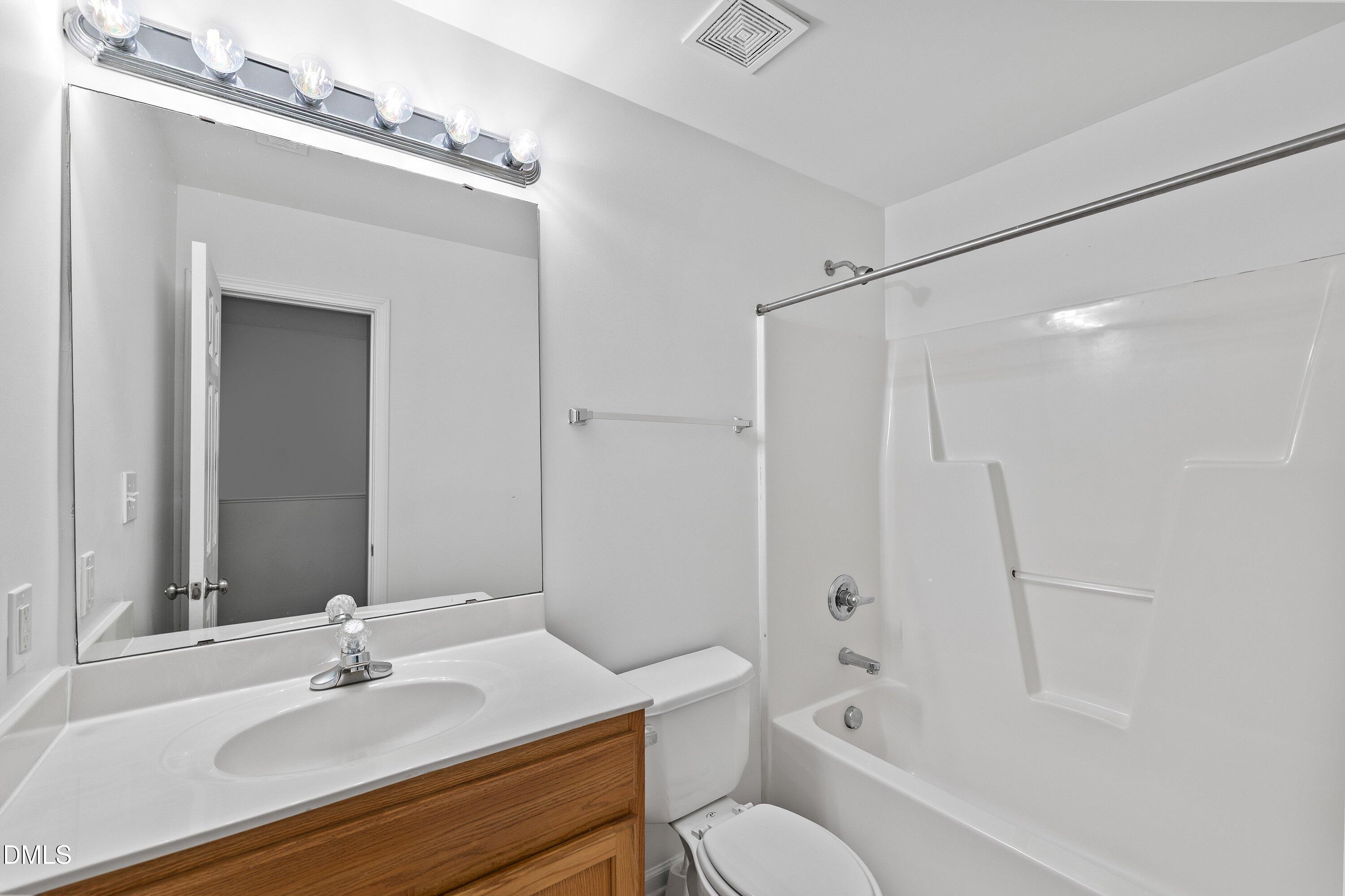 8321 Glenwood Springs Court Raleigh, NC 27616 - Photo 28 of 37 a bathroom with a sink toilet tub and shower