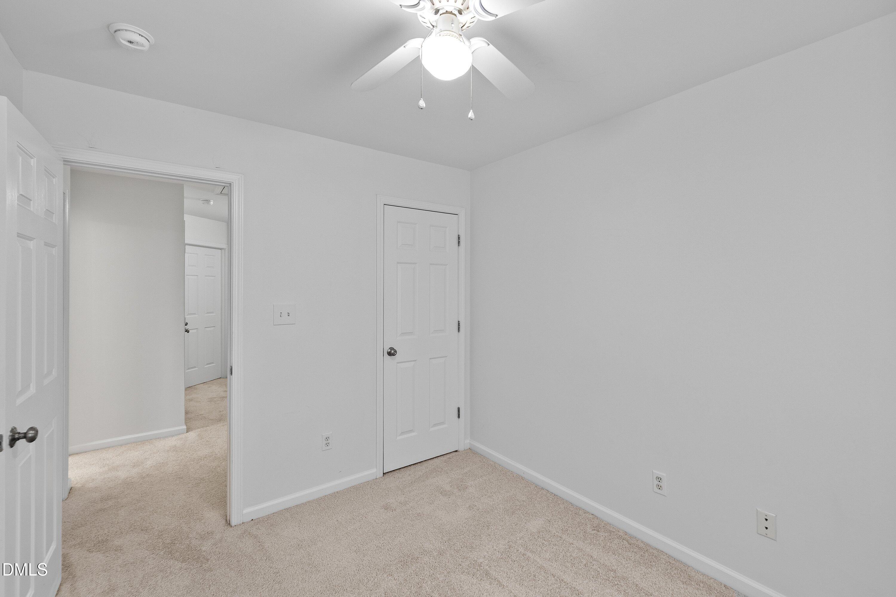 8321 Glenwood Springs Court Raleigh, NC 27616 - Photo 32 of 37 a view of an empty room with a window