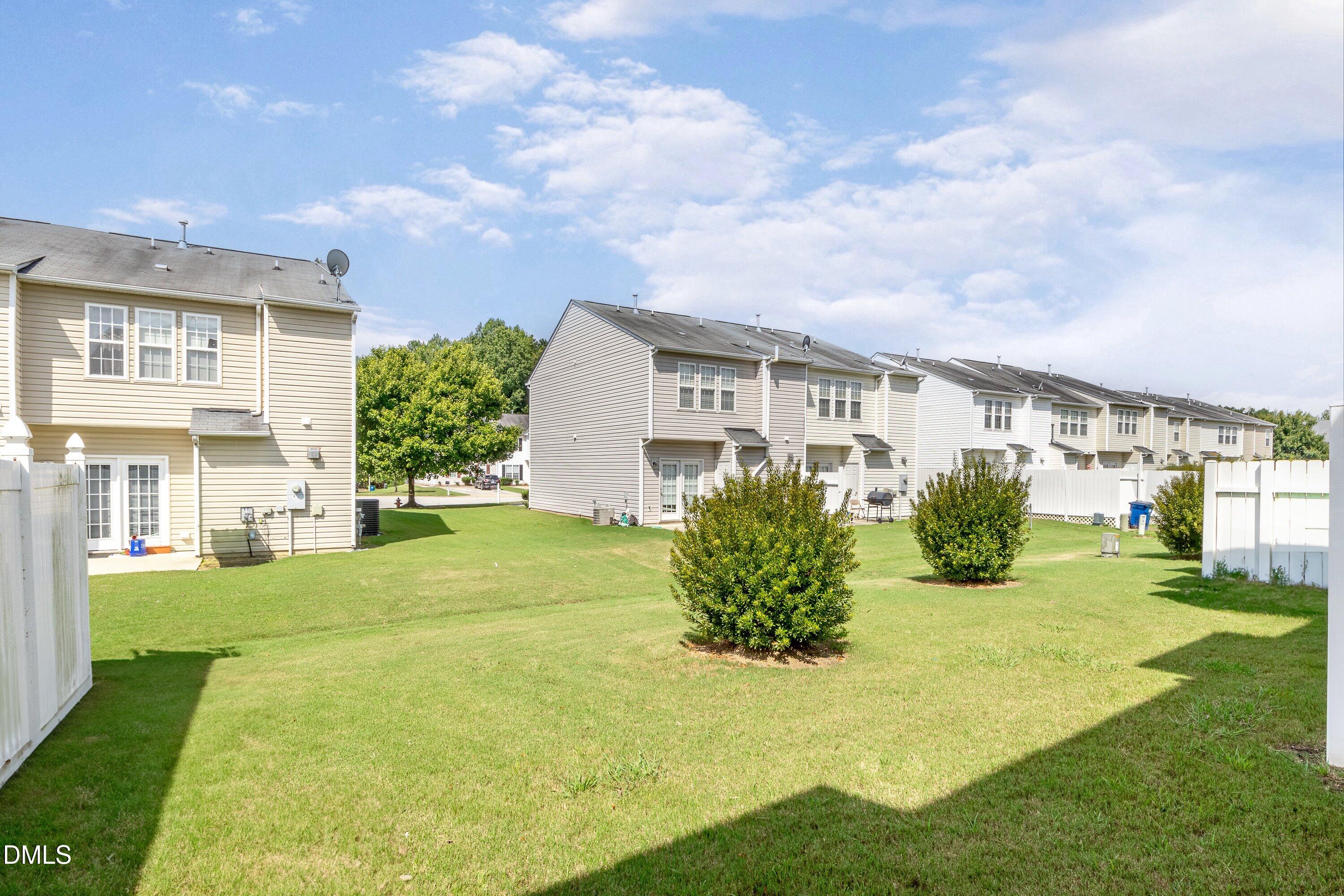 8321 Glenwood Springs Court Raleigh, NC 27616 - Photo 33 of 37 a front view of a house with garden