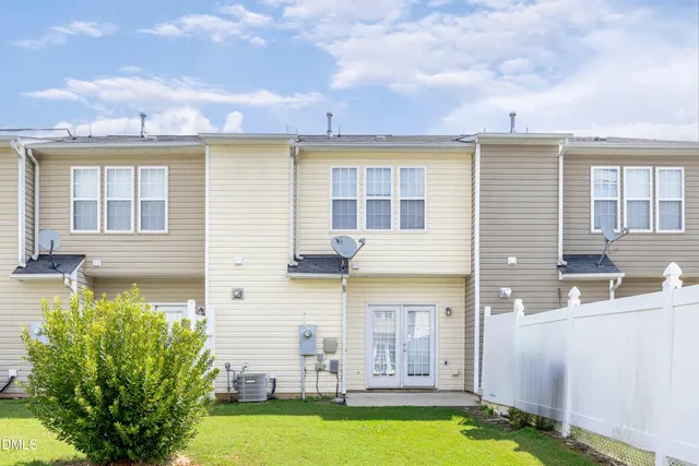 a front view of a house with swimming pool and porch