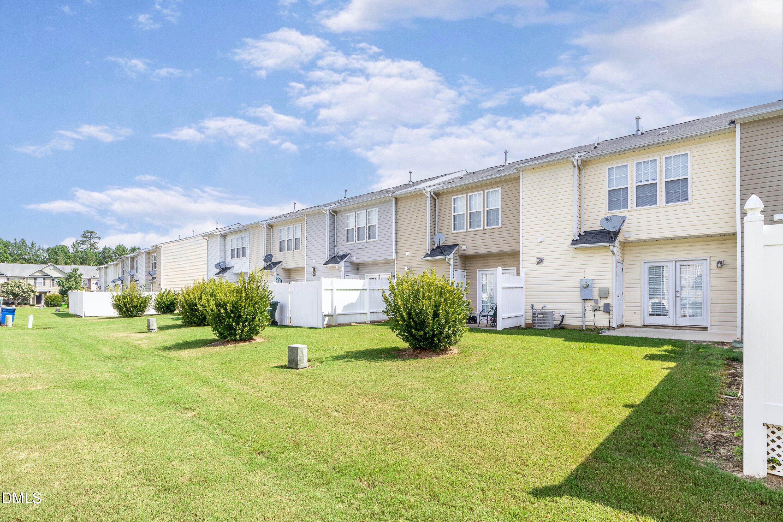 8321 Glenwood Springs Court Raleigh, NC 27616 - Photo 36 of 37 a view of a house with a big yard and a large tree
