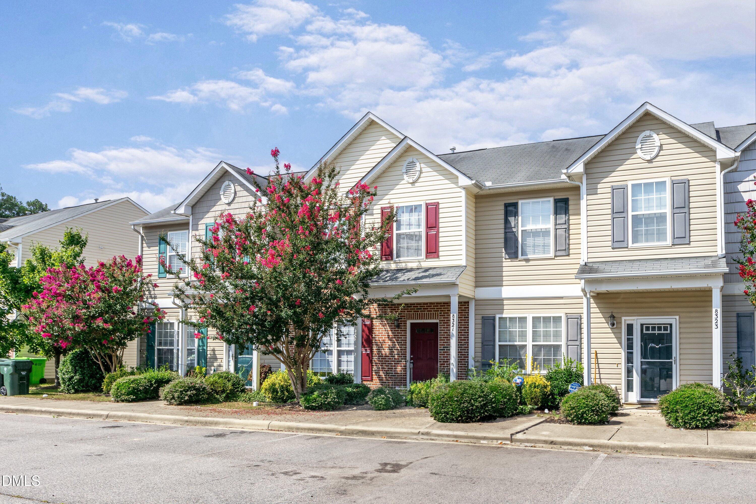 8321 Glenwood Springs Court Raleigh, NC 27616 - Photo 3 of 37 a front view of a house with a yard and garage