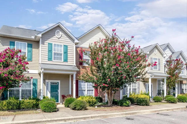 a front view of a house with yard
