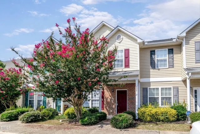 a front view of a house with yard