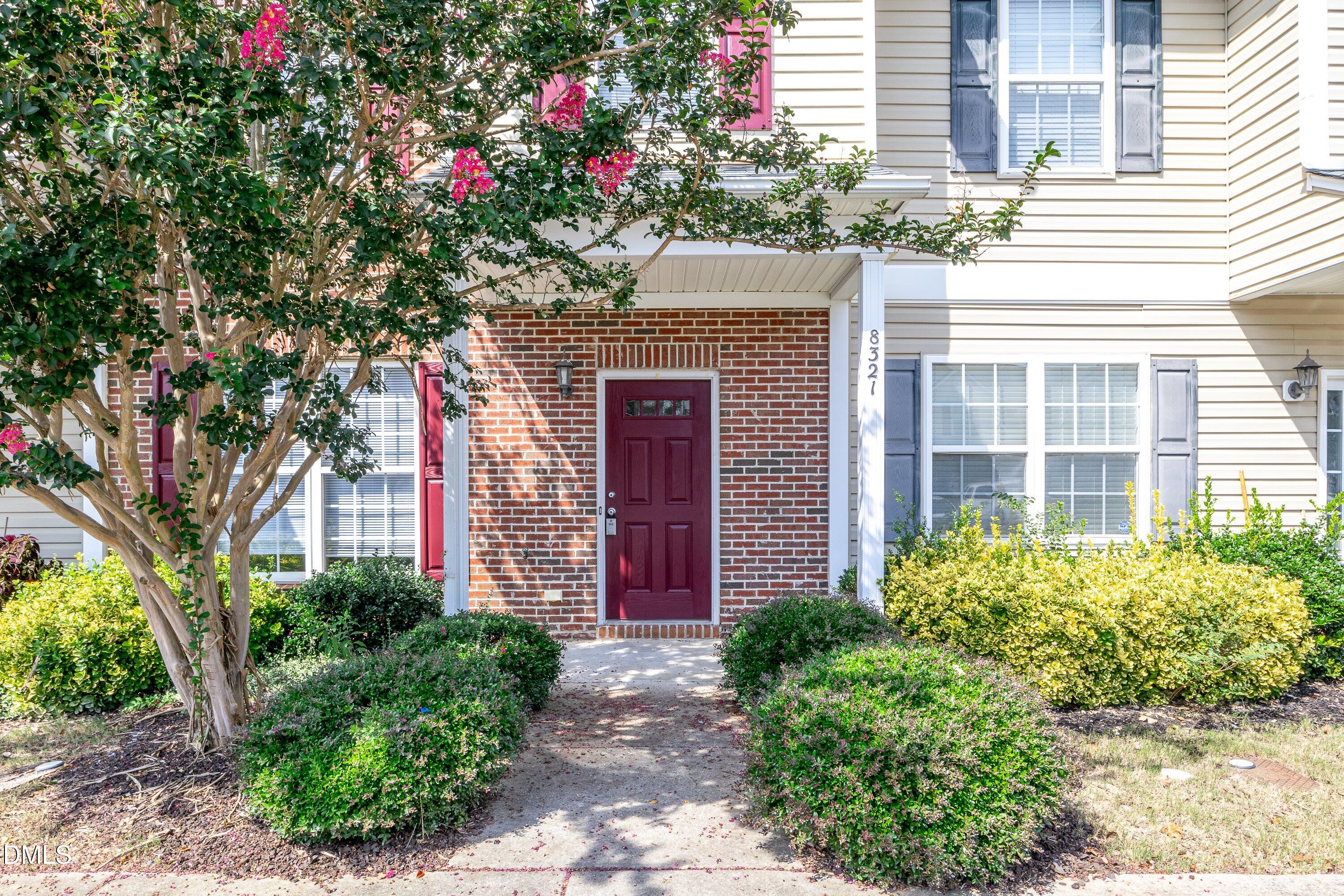 8321 Glenwood Springs Court Raleigh, NC 27616 - Photo 6 of 37 a front view of a house with plants