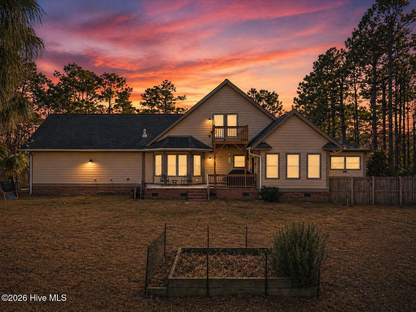 18 Brierwood Road Southwest Shallotte, NC 28470 - Photo 5 of 70 Twilight photo for the back exterior of 18 Brierwood Road.