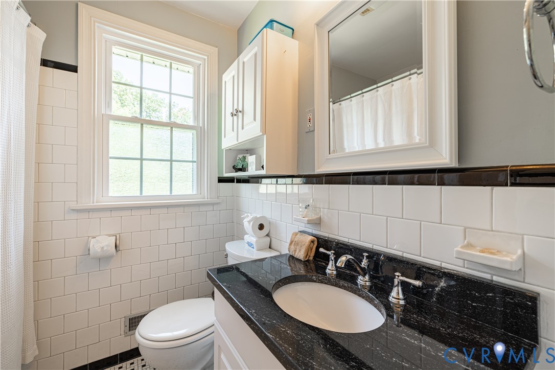 1107 Ridgecrest Drive Henrico, VA 23229 - Photo 14 of 26 Bathroom featuring a black granite top vanity coun