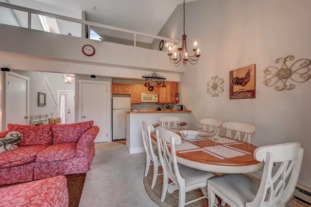 a kitchen with stainless steel appliances granite countertop a sink a refrigerator and a stove