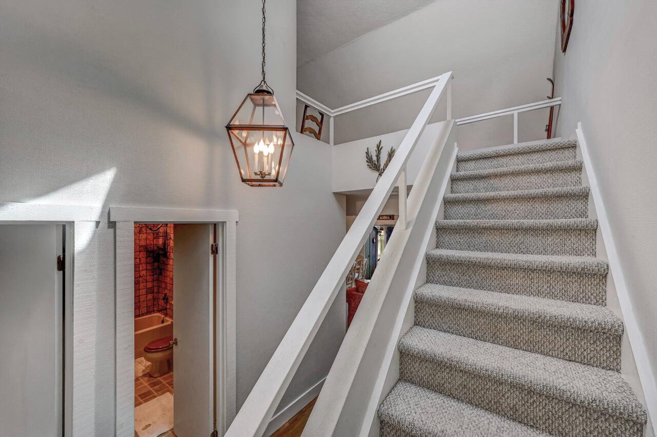116 Snow Ridge Cir Lake Lake Harmony, PA 18624 - Photo 33 of 48 a view of staircase with a rug and a chandelier