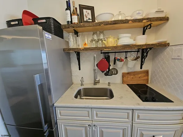 a kitchen with a cabinets and white appliances