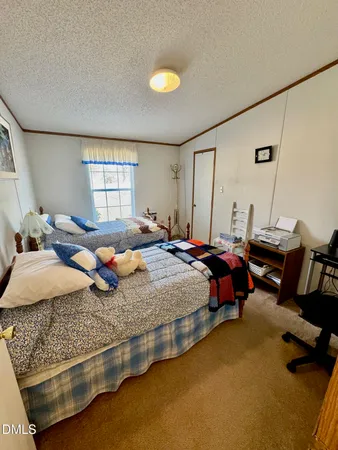 a bed room with a bed and a window