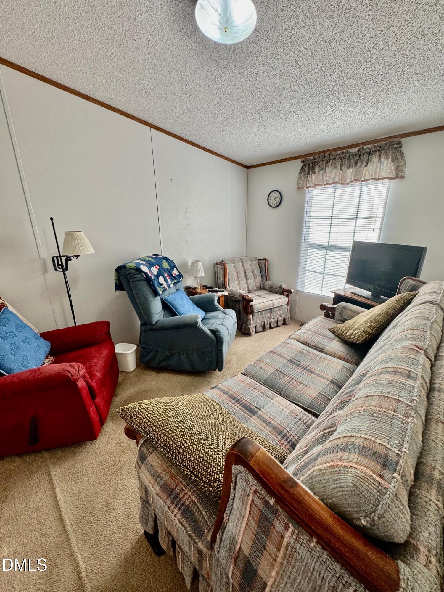 1595 Spring Valley Lake Road Henderson, NC 27537 - Photo 18 of 27 a bedroom with furniture and a window