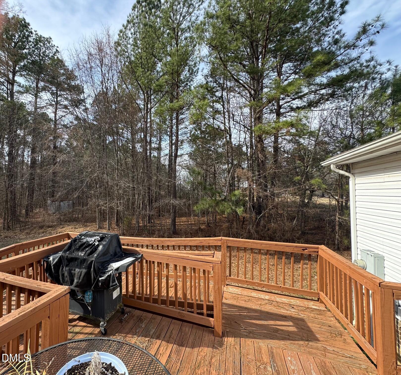 1595 Spring Valley Lake Road Henderson, NC 27537 - Photo 25 of 27 a view of balcony with wooden floor and outdoor seating