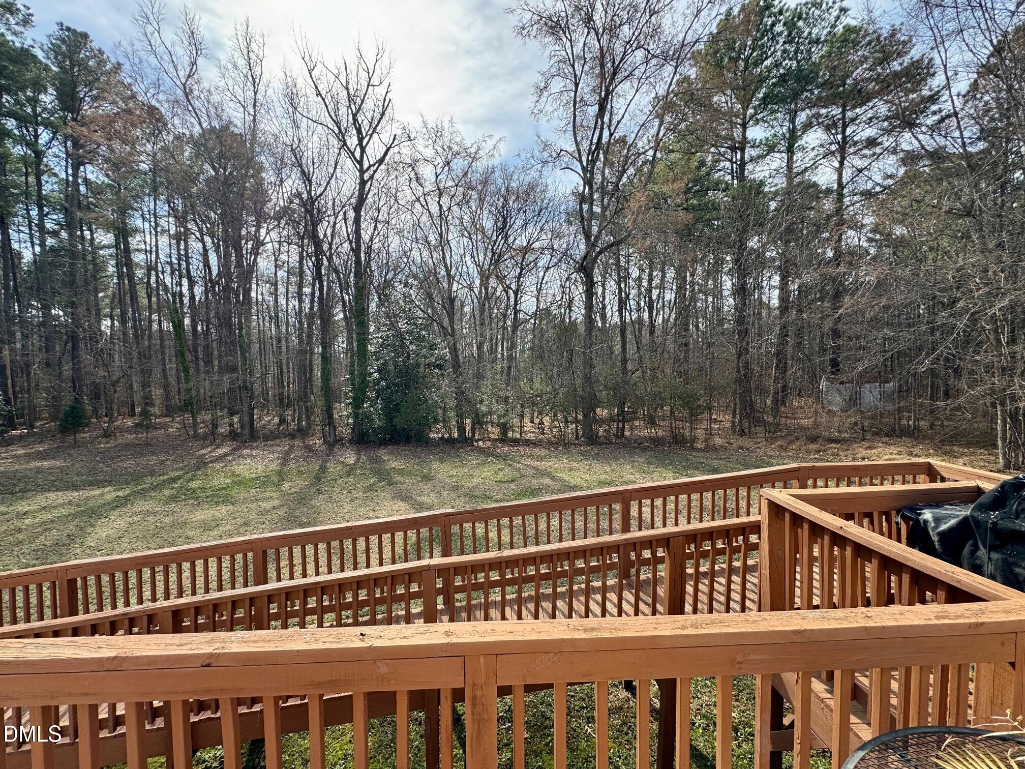 1595 Spring Valley Lake Road Henderson, NC 27537 - Photo 26 of 27 a view of a house with a wooden fence
