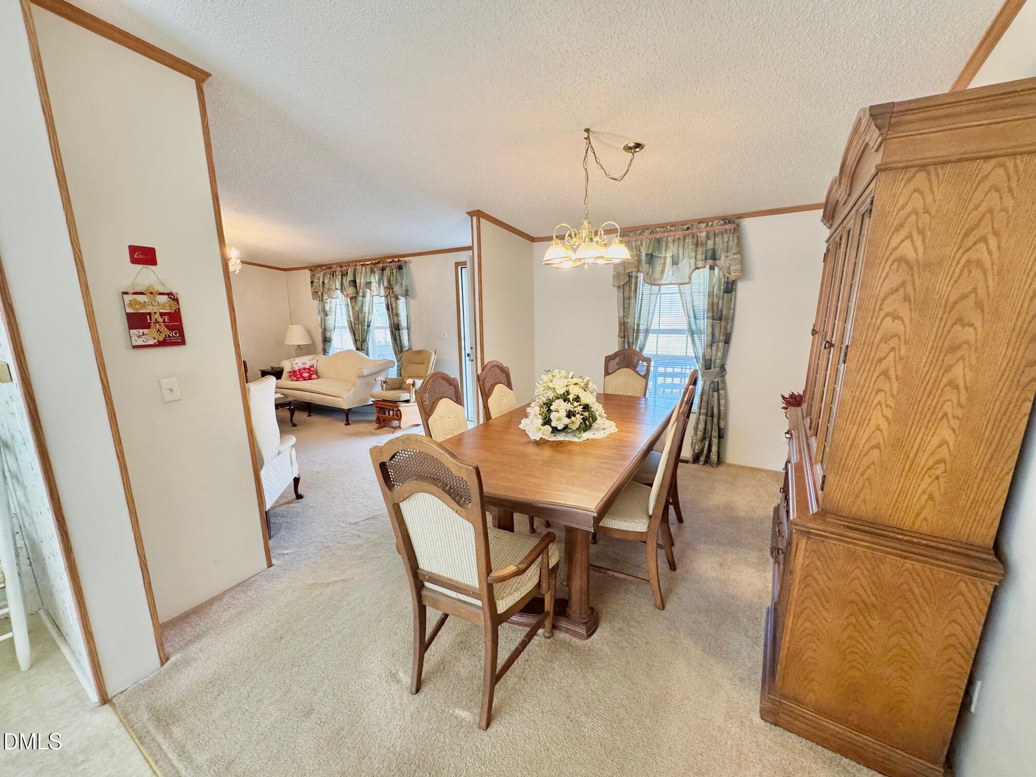 1595 Spring Valley Lake Road Henderson, NC 27537 - Photo 6 of 27 a dining room with furniture and window