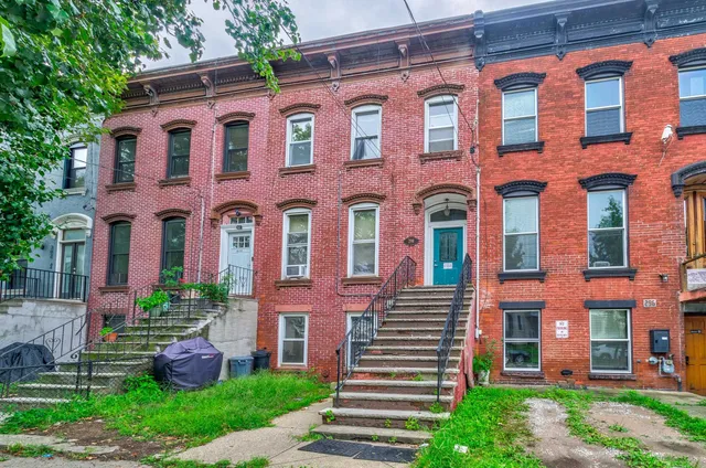 a front view of a multi story residential apartment building