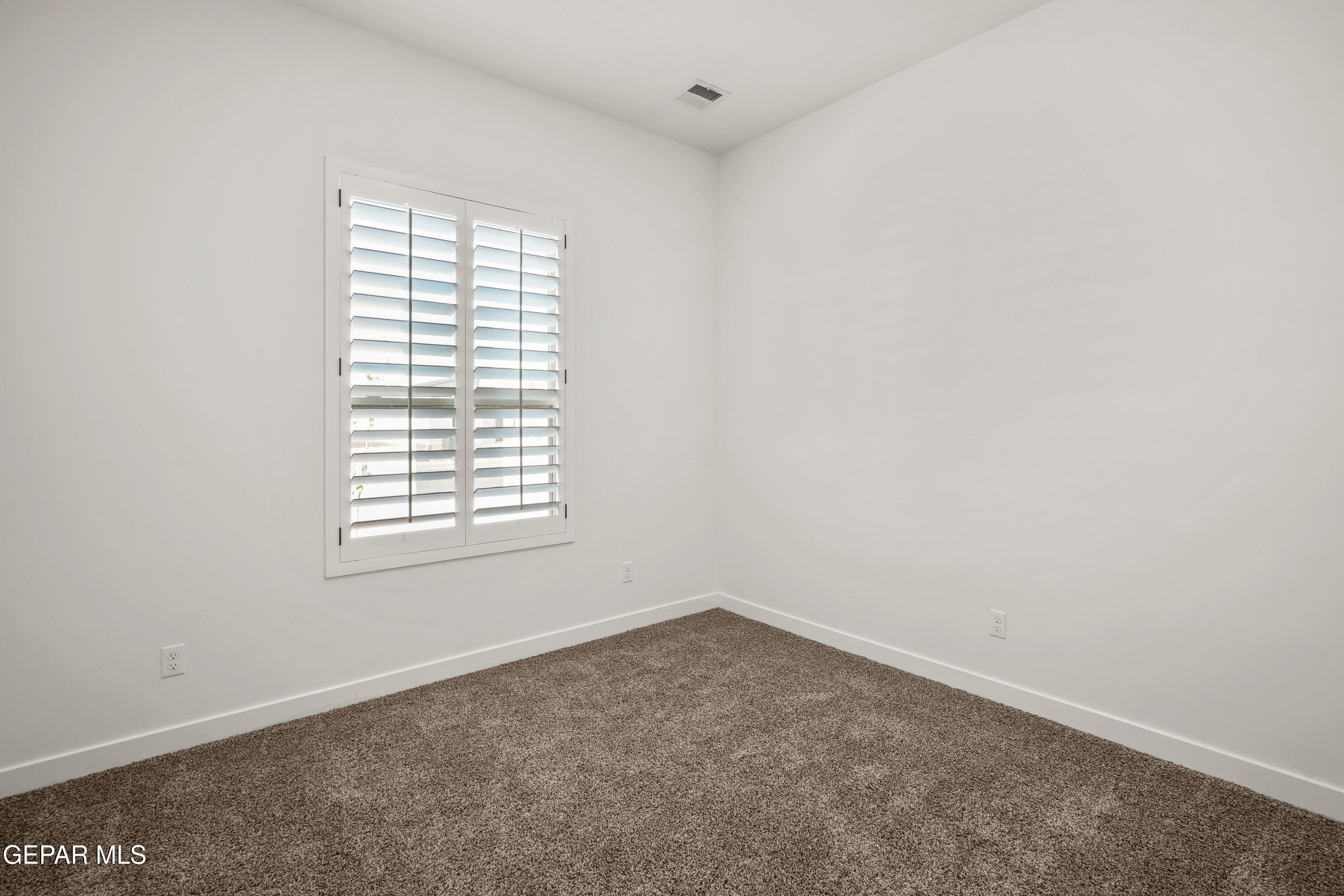15224 Resolve El Paso, TX 79938 - Photo 3 of 38 an empty room with a window