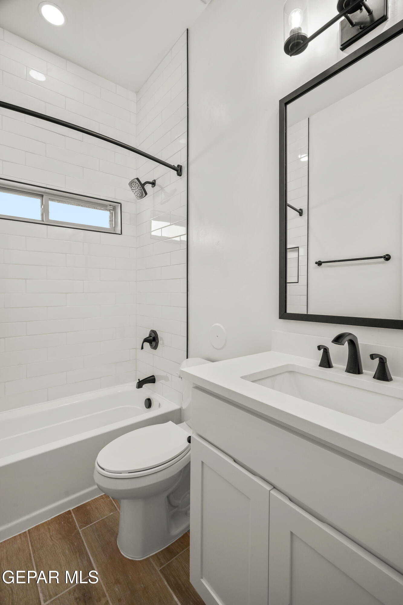 15224 Resolve El Paso, TX 79938 - Photo 5 of 38 a bathroom with a toilet sink a mirror and shower